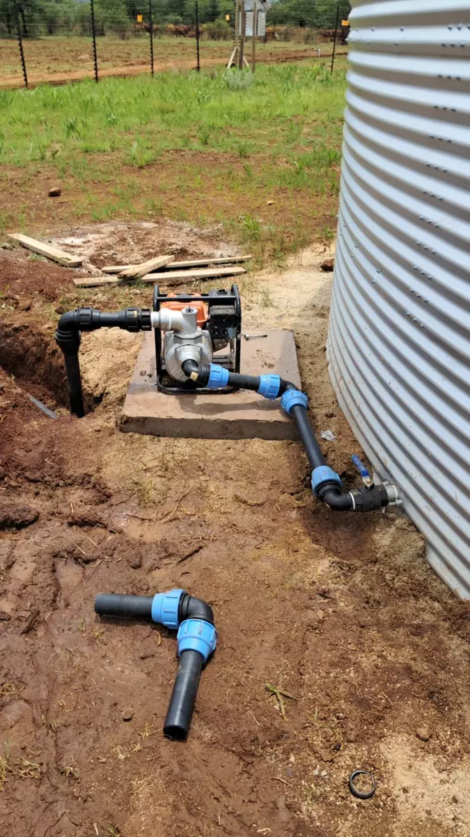 Water pump connected to a corrugated water tank